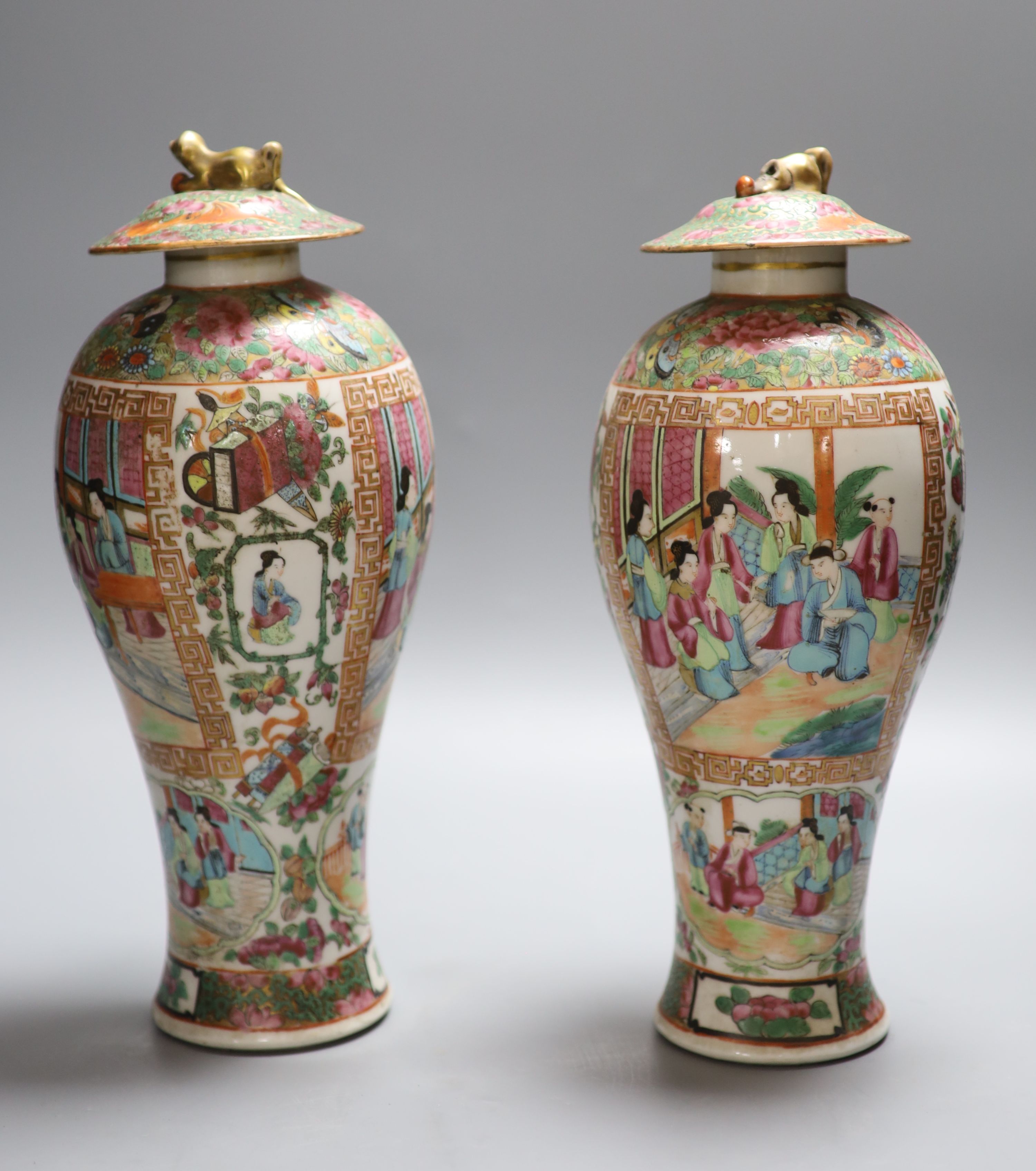 A pair of 19th century Chinese famille rose vases and associated covers, height excl. cover 28cm (a.f.)